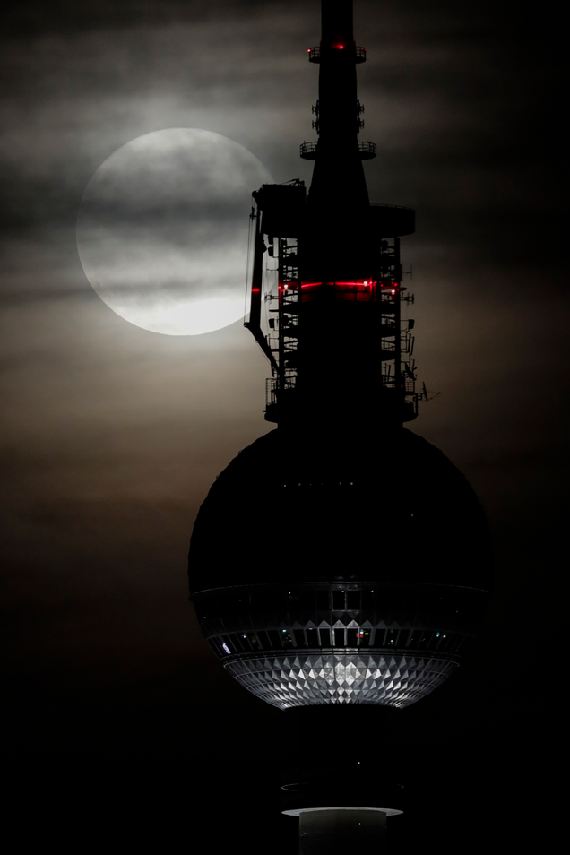 Moon rising behind a TV tower in Berlin, Germany. Image: Markus Schreiber/AP